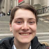 smiley young woman with short hair in New York City